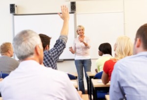 Adults studying in classroom